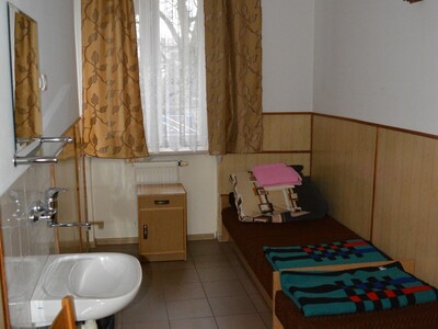 A twin room in Niepokalanów pilgrim’s house